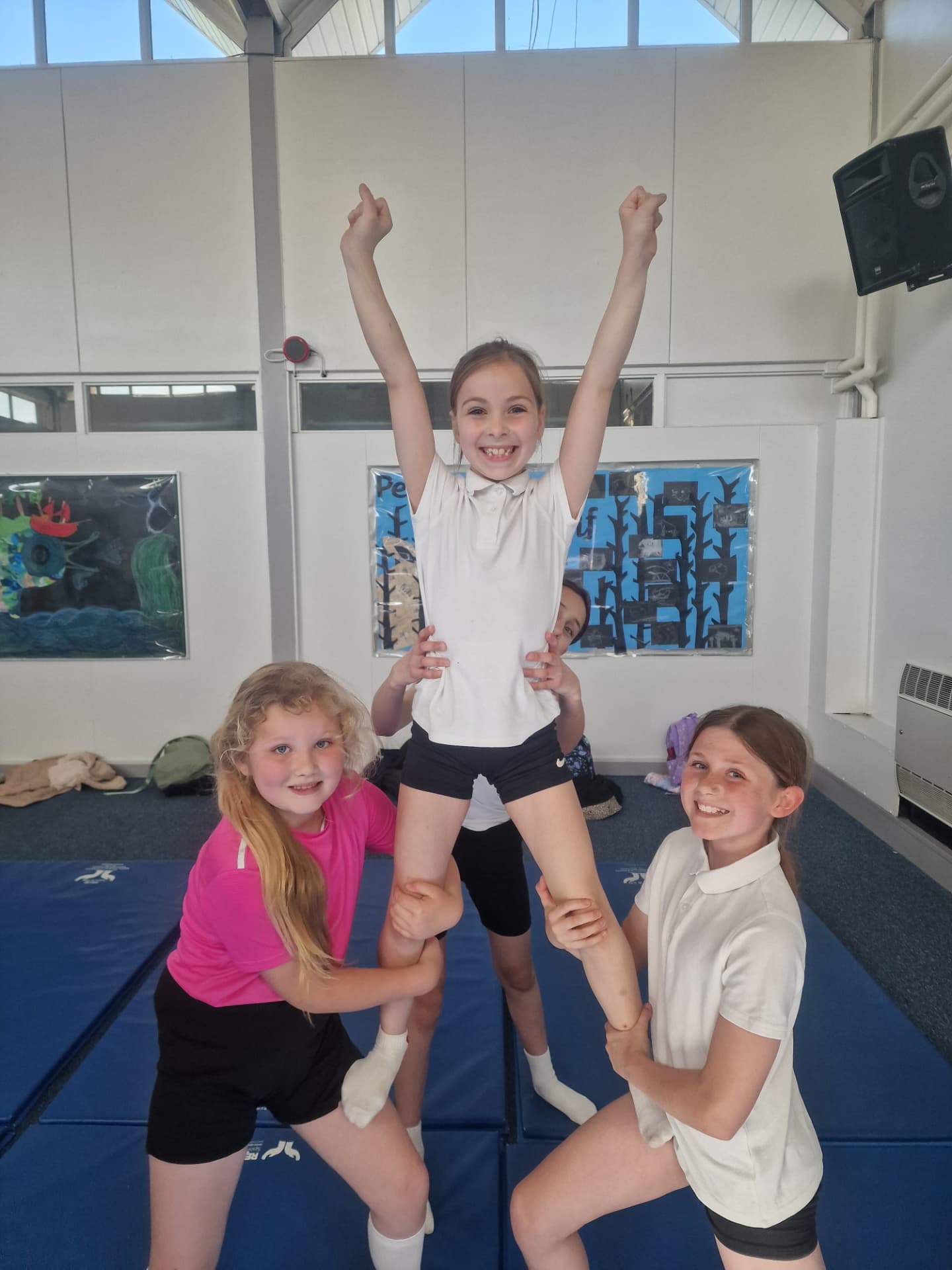 KSAL cheerleading club members performing a lift at Bar Hill Primary School
